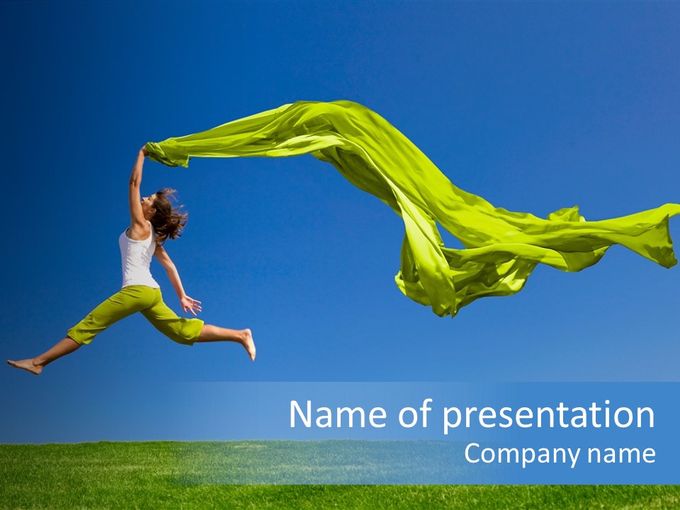 Beautiful Young Woman Jumping On A Green Meadow With A Colored Tissue PowerPoint Template