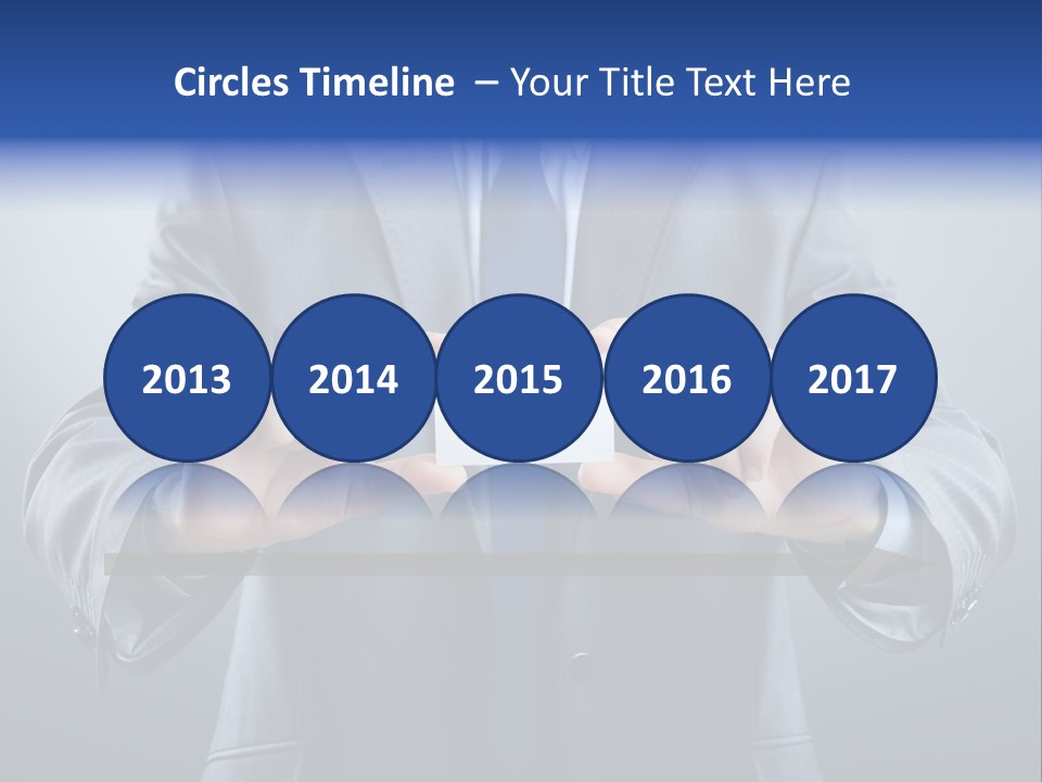 A Man In A Suit Holding A Business Card PowerPoint Template