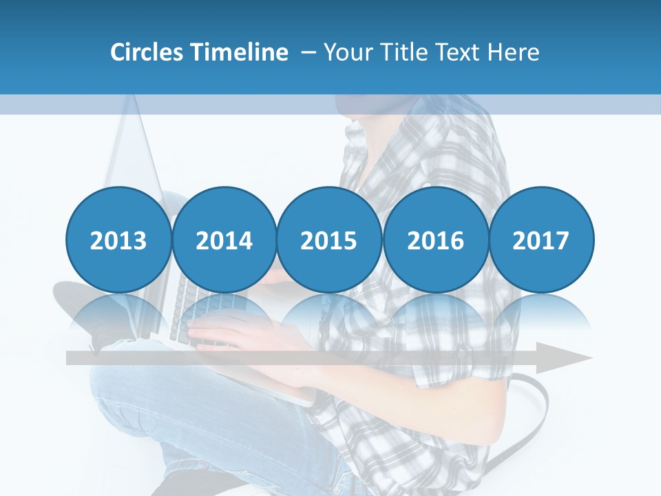 A Young Man Sitting On The Floor Using A Laptop Computer PowerPoint Template