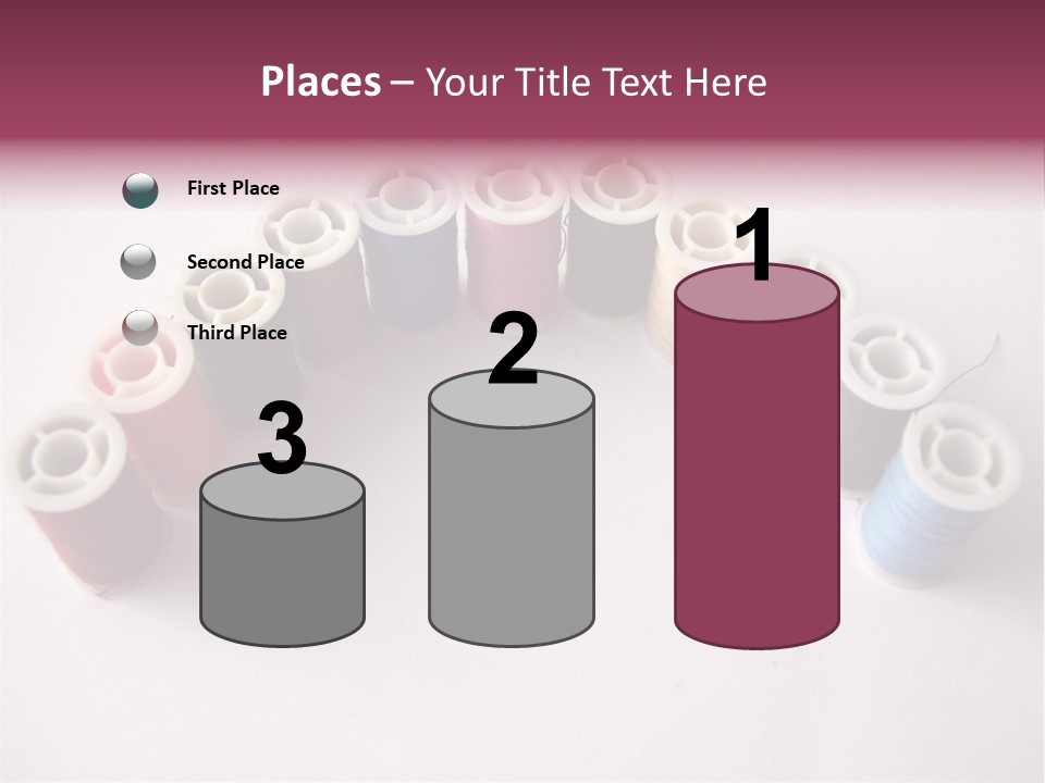 A Group Of Spools Of Thread On A White Surface PowerPoint Template
