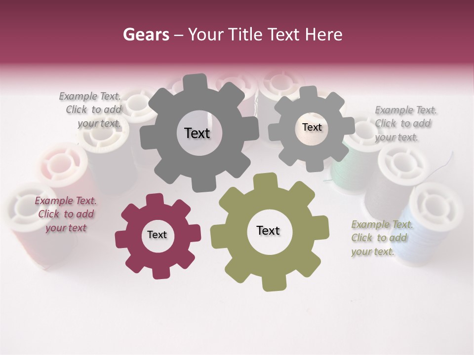 A Group Of Spools Of Thread On A White Surface PowerPoint Template