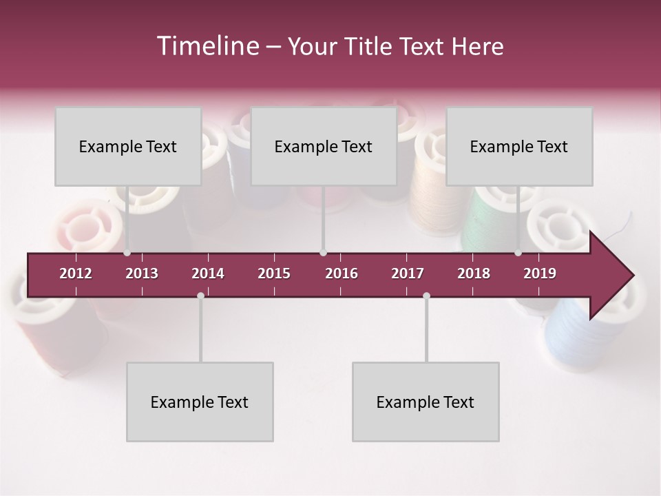 A Group Of Spools Of Thread On A White Surface PowerPoint Template