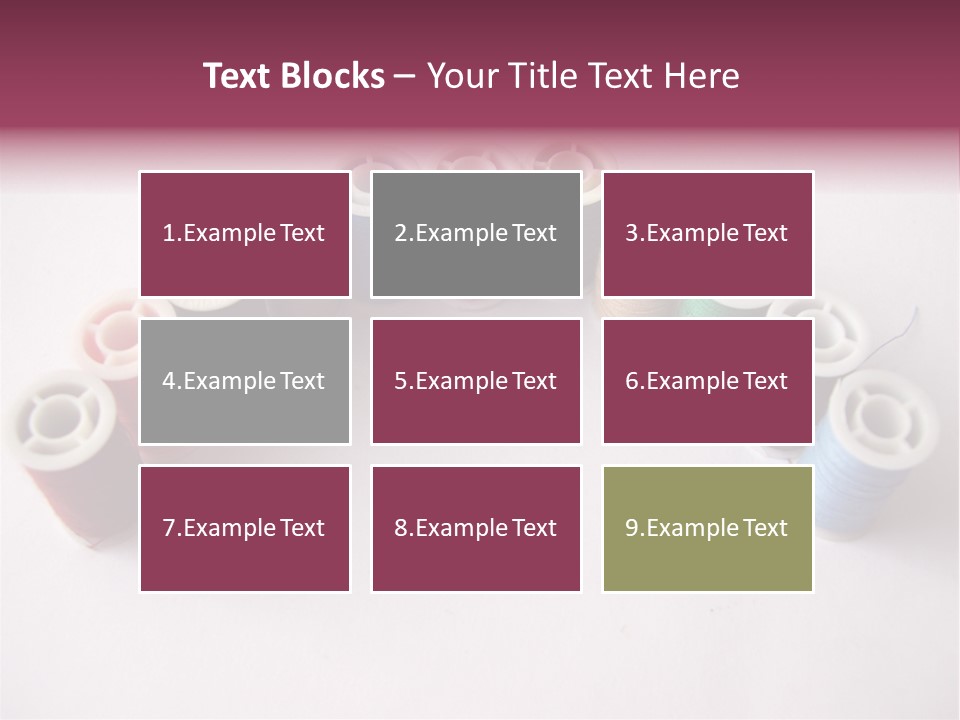 A Group Of Spools Of Thread On A White Surface PowerPoint Template
