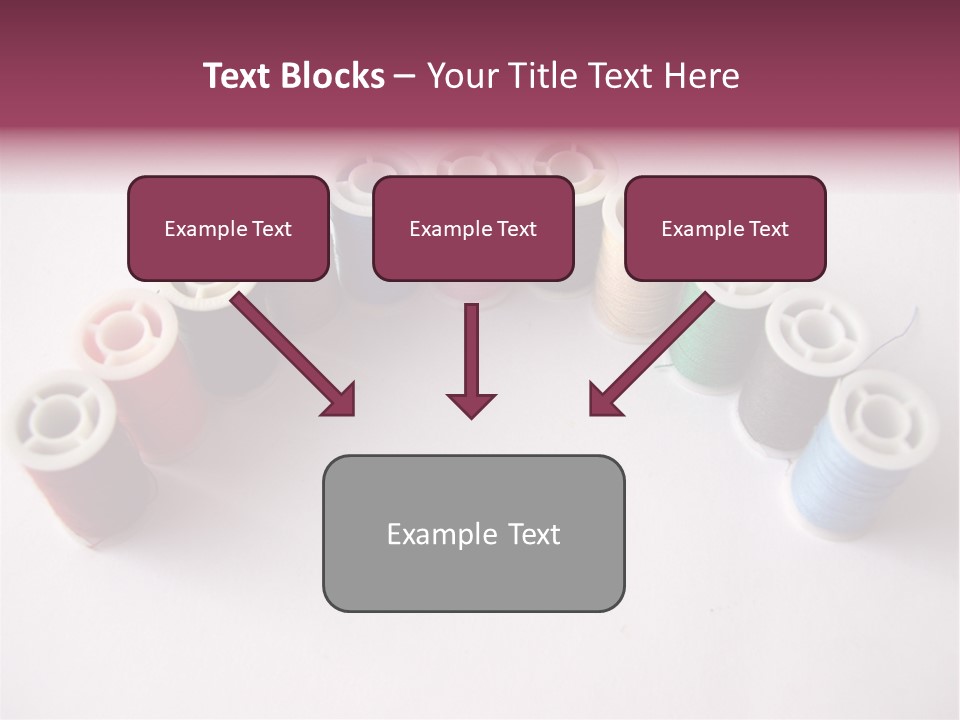 A Group Of Spools Of Thread On A White Surface PowerPoint Template