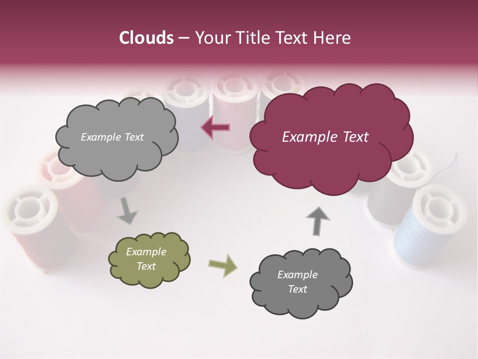 A Group Of Spools Of Thread On A White Surface PowerPoint Template
