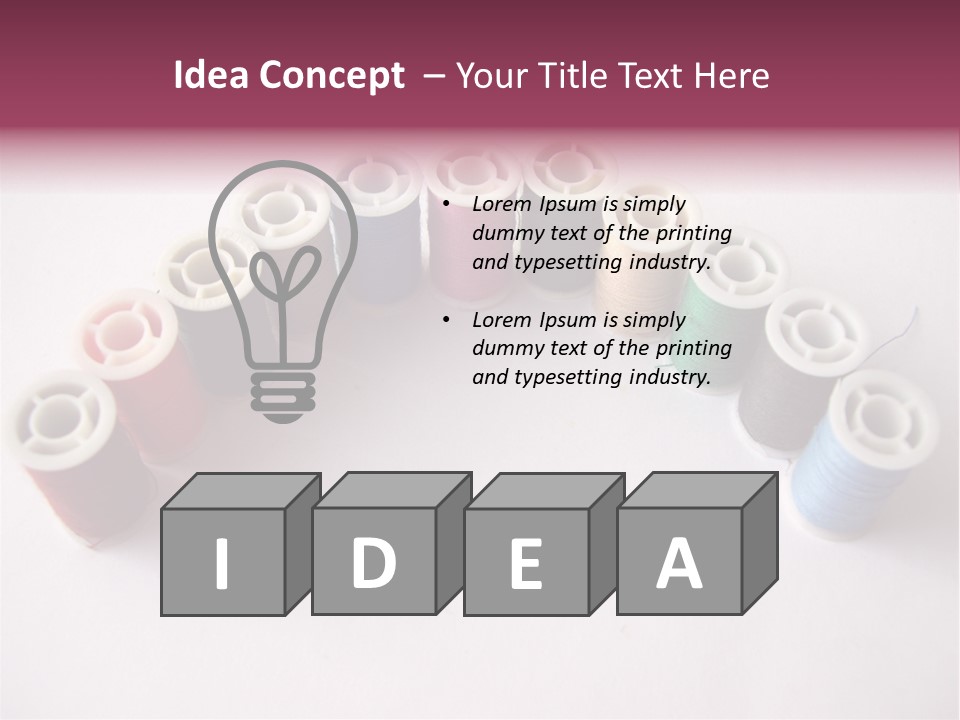 A Group Of Spools Of Thread On A White Surface PowerPoint Template