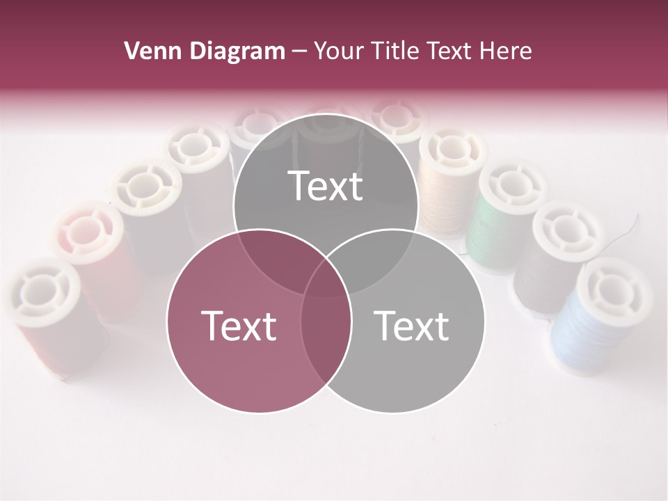 A Group Of Spools Of Thread On A White Surface PowerPoint Template