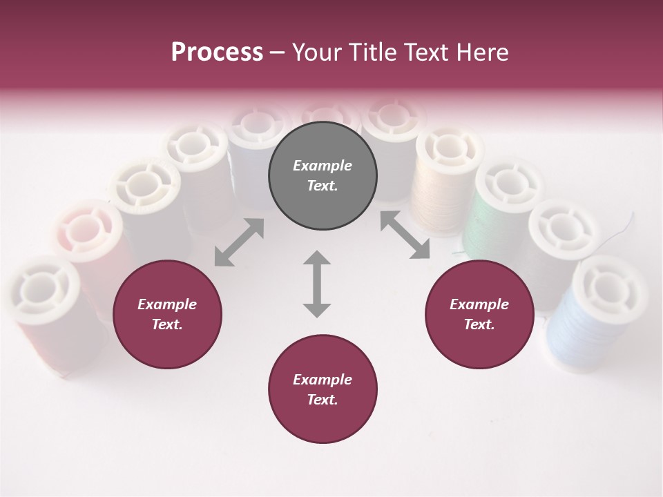 A Group Of Spools Of Thread On A White Surface PowerPoint Template