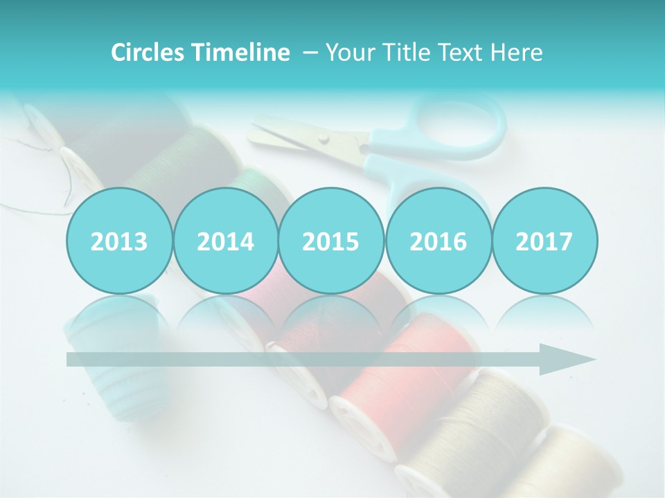 A Pair Of Scissors And Spools Of Thread On A Table PowerPoint Template