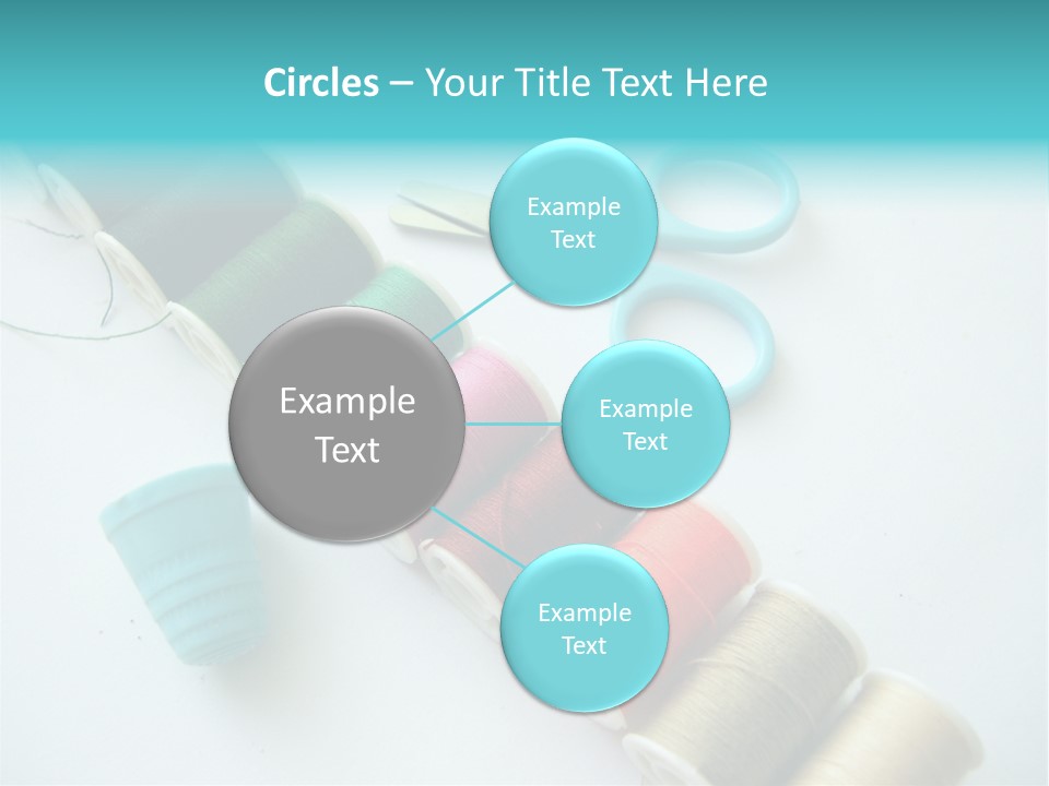 A Pair Of Scissors And Spools Of Thread On A Table PowerPoint Template
