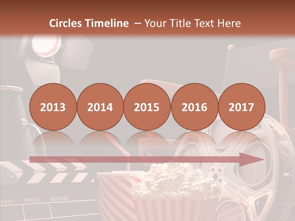 A Movie Projector And A Bucket Of Popcorn On A Table PowerPoint Template
