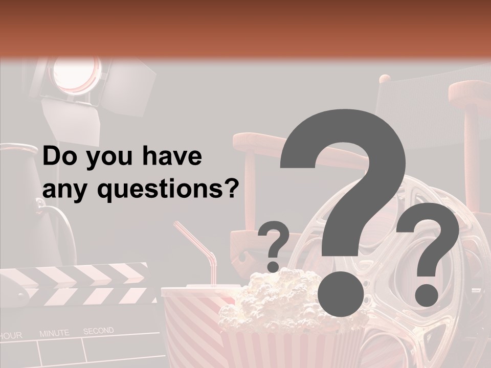 A Movie Projector And A Bucket Of Popcorn On A Table PowerPoint Template
