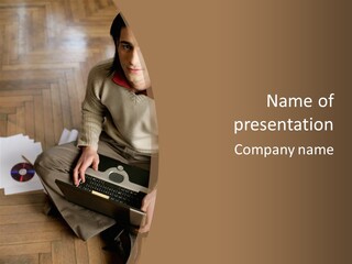 Man Sitting On The Floor With Laptop PowerPoint Template