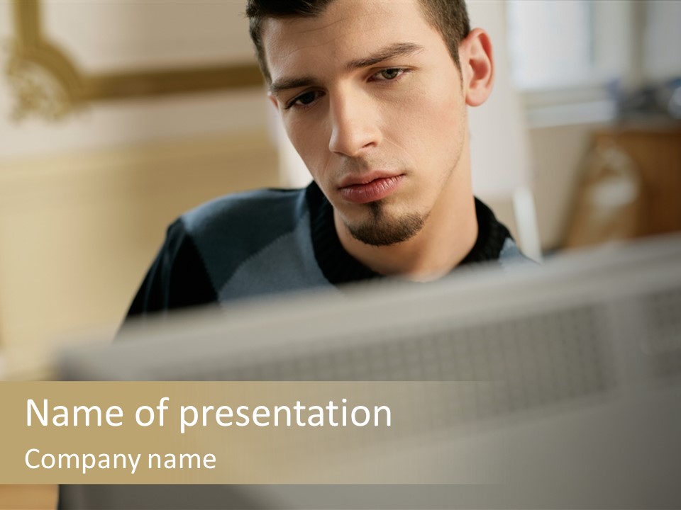 Man At His Computer PowerPoint Template