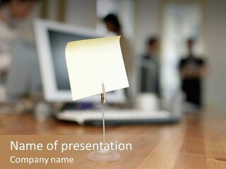 Blank Note In Holder On Desk PowerPoint Template