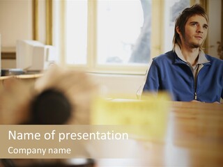 Man Daydreaming At His Desk PowerPoint Template