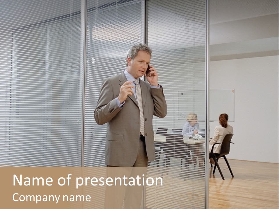 Businessman Using A Cellular Telephone PowerPoint Template