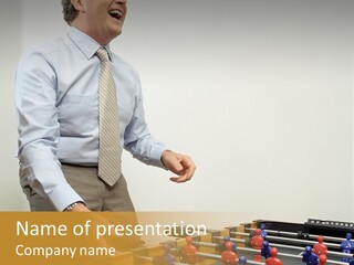 Businessman Playing Table Football PowerPoint Template