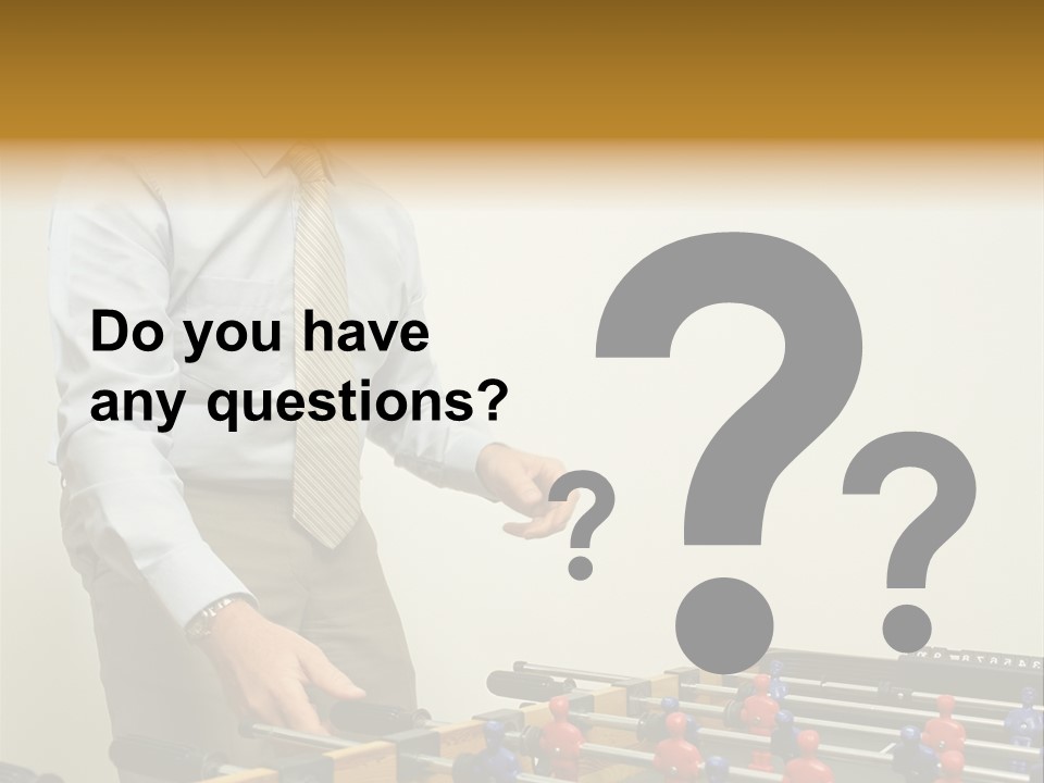 Businessman Playing Table Football PowerPoint Template