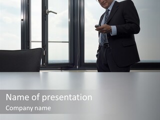 Businessman Using Mobile Phone PowerPoint Template