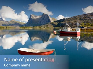 Two Boats In The Water With Mountains In The Background PowerPoint Template