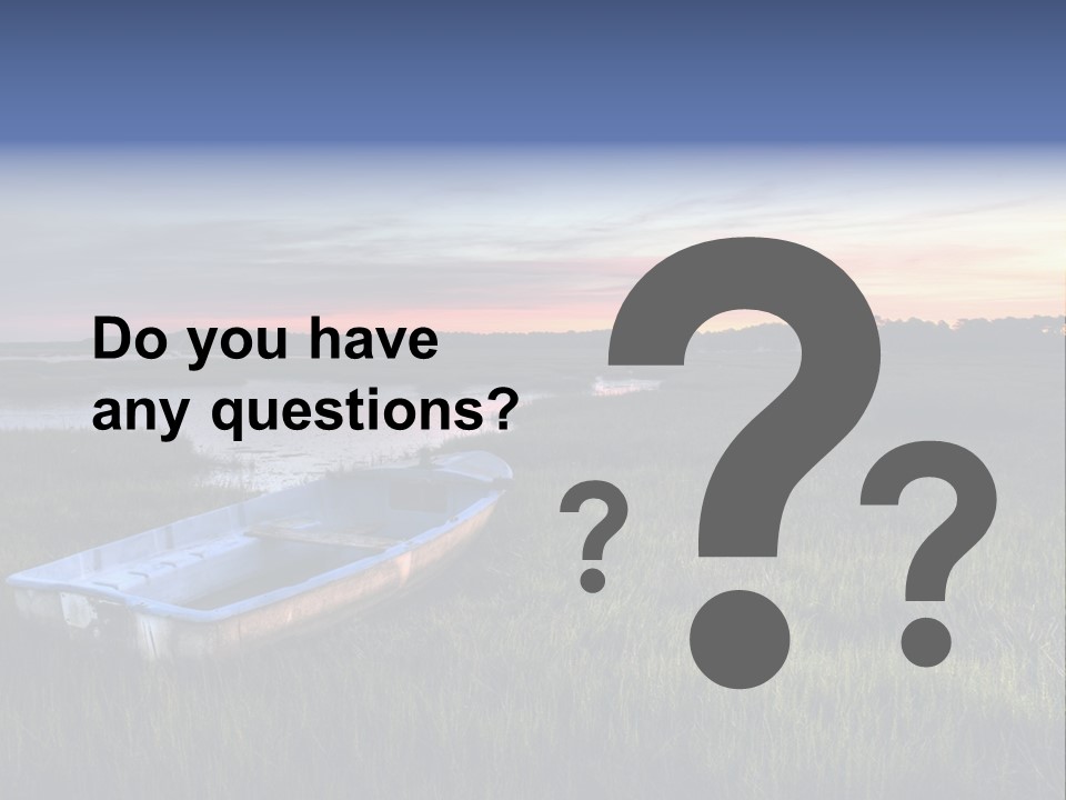 A Boat Sitting On Top Of A Lush Green Field PowerPoint Template