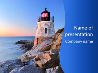 A Lighthouse On A Rocky Shore With The Ocean In The Background PowerPoint Template
