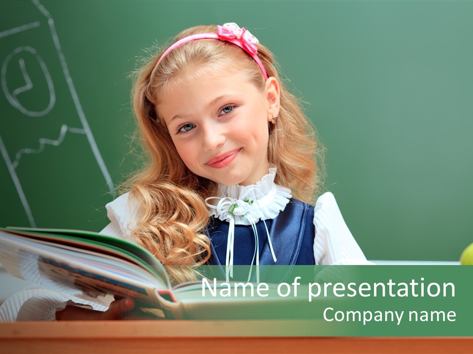 A Young Girl Is Reading A Book In Front Of A Chalkboard PowerPoint Template