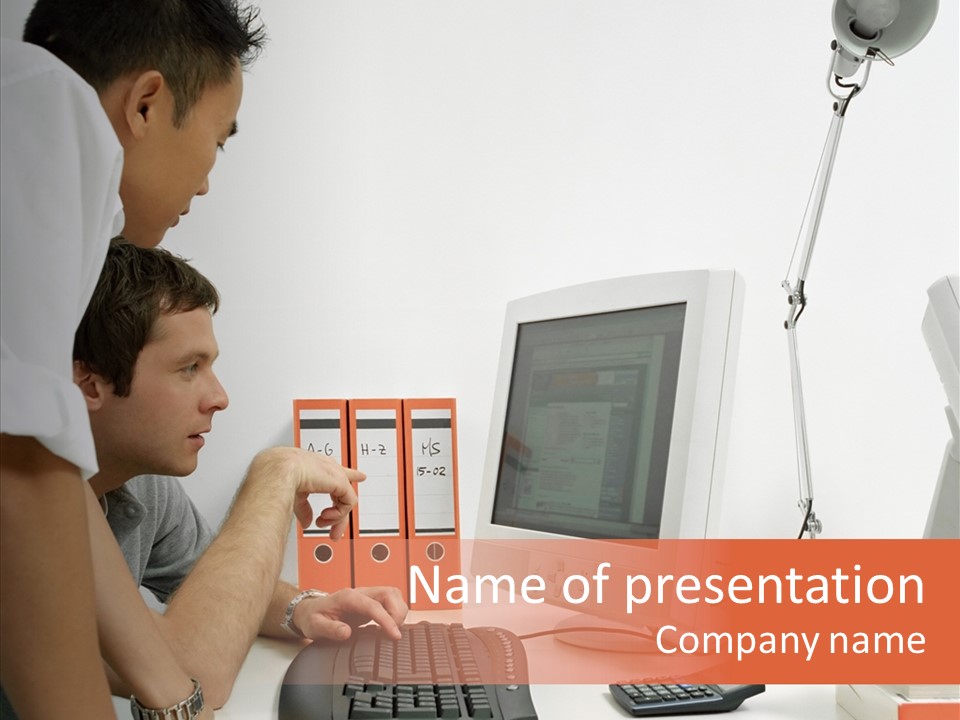 Office Workers Looking At Computer Monitor PowerPoint Template