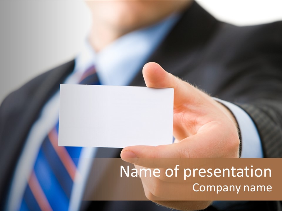 A Man In A Suit Holding A Business Card PowerPoint Template