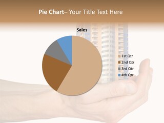 A Hand Holding A Model Of A Building PowerPoint Template