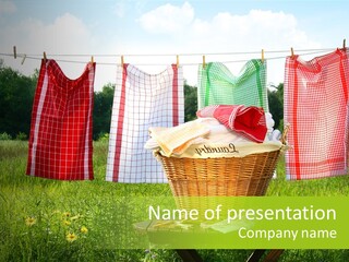 A Basket With Clothes Hanging On A Clothes Line PowerPoint Template