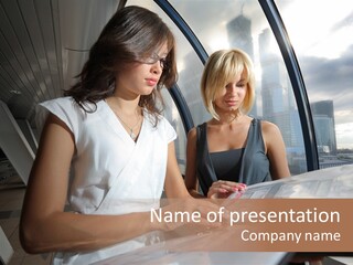 Two Women Are Looking At A Piece Of Paper PowerPoint Template