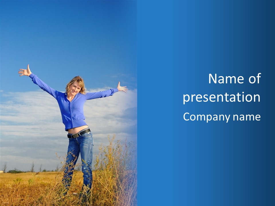 A Woman Standing In A Field With Her Arms Outstretched PowerPoint Template