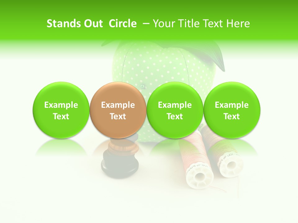 A Green Apple Sitting Next To Two Spools Of Thread PowerPoint Template