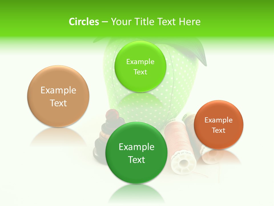 A Green Apple Sitting Next To Two Spools Of Thread PowerPoint Template