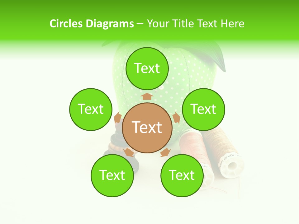 A Green Apple Sitting Next To Two Spools Of Thread PowerPoint Template
