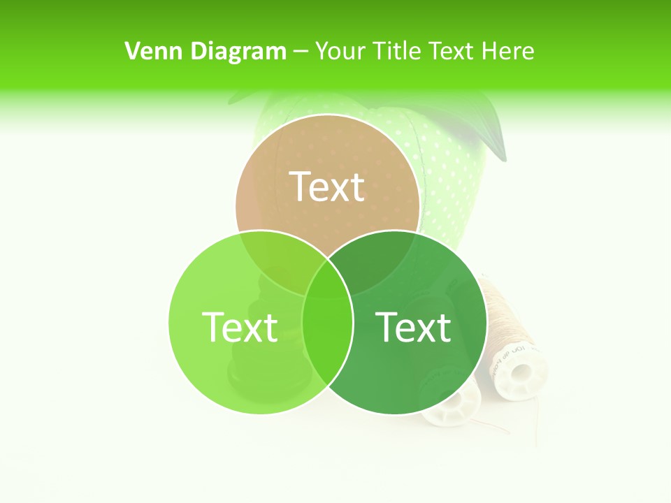 A Green Apple Sitting Next To Two Spools Of Thread PowerPoint Template