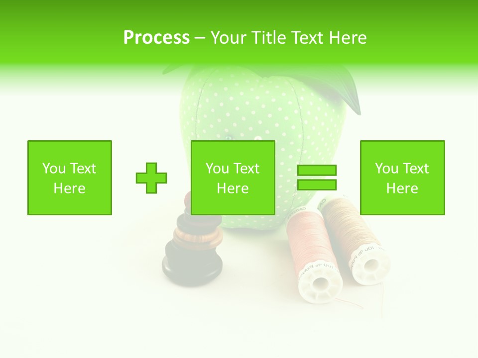 A Green Apple Sitting Next To Two Spools Of Thread PowerPoint Template