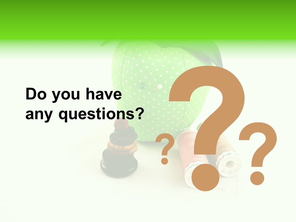 A Green Apple Sitting Next To Two Spools Of Thread PowerPoint Template