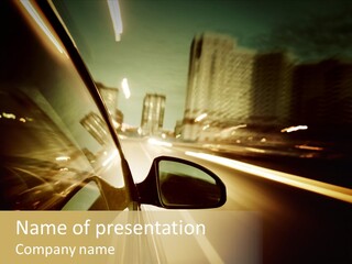 A Car Driving Down A City Street At Night PowerPoint Template
