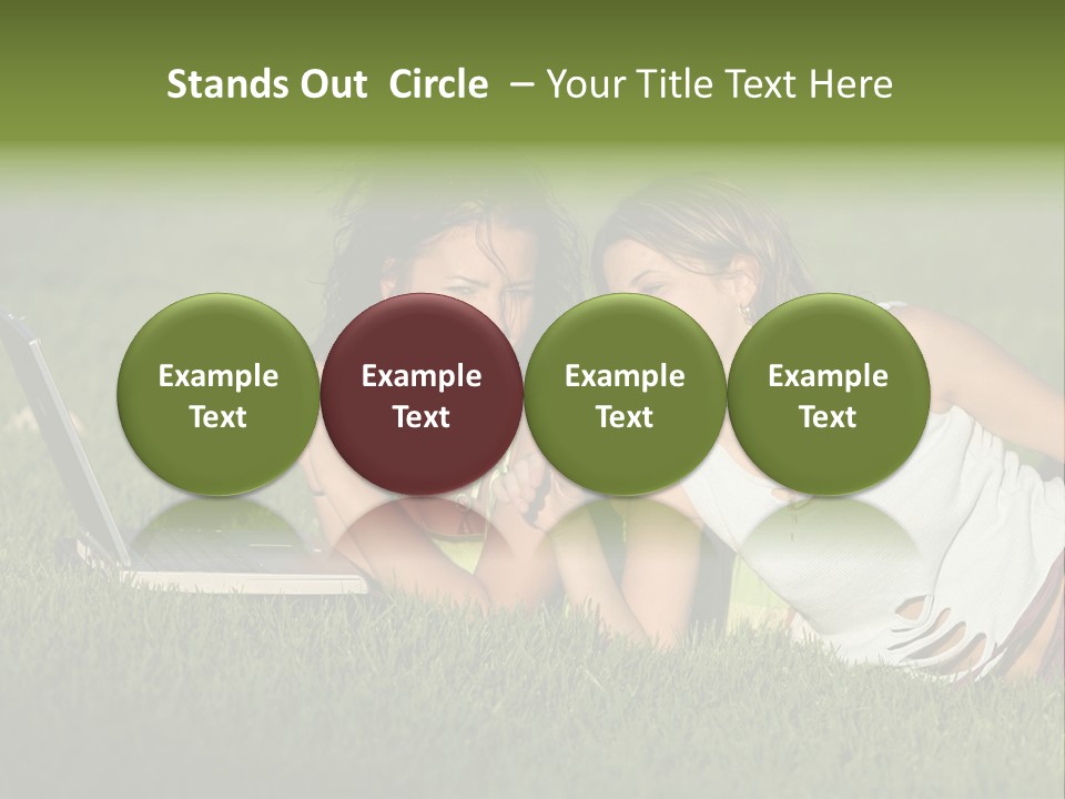 Two Women Laying In The Grass With A Laptop PowerPoint Template