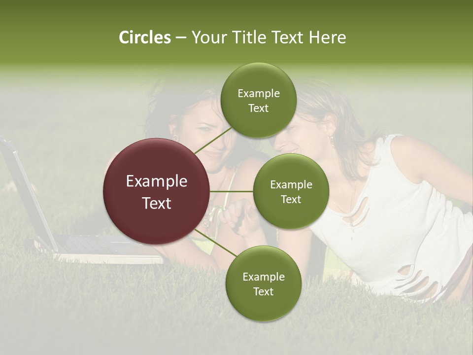 Two Women Laying In The Grass With A Laptop PowerPoint Template