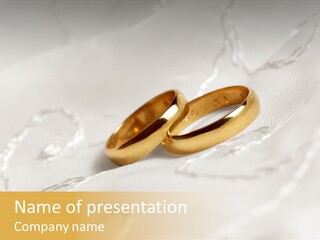 Two Gold Wedding Rings On A White Background PowerPoint Template