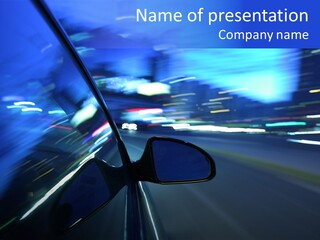 A Car Driving Down A City Street At Night PowerPoint Template