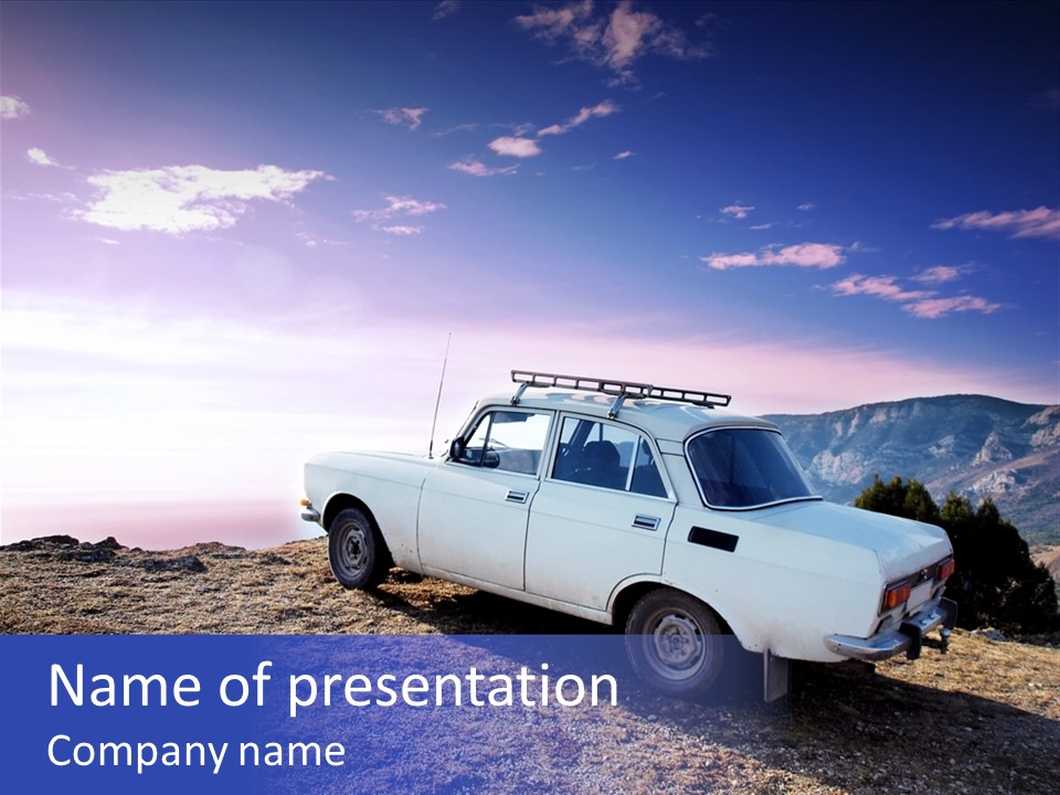 A White Car Parked On Top Of A Mountain PowerPoint Template