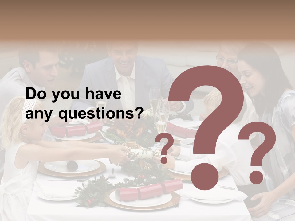 A Group Of People Sitting Around A Table With Food PowerPoint Template