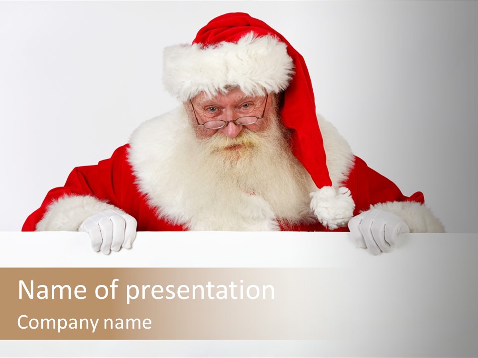 A Man Dressed As Santa Claus Holding A Sign PowerPoint Template