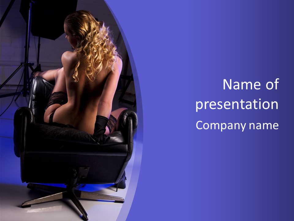 A Naked Woman Sitting In A Chair In Front Of A Camera PowerPoint Template