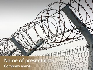A Barbed Fence With Razors On Top Of It PowerPoint Template